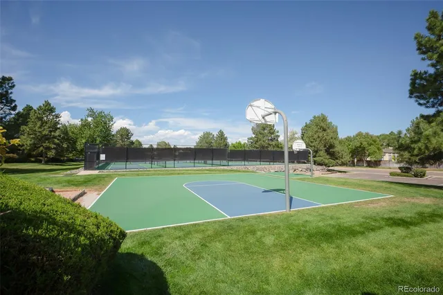 a view of a swimming pool with an outdoor seating