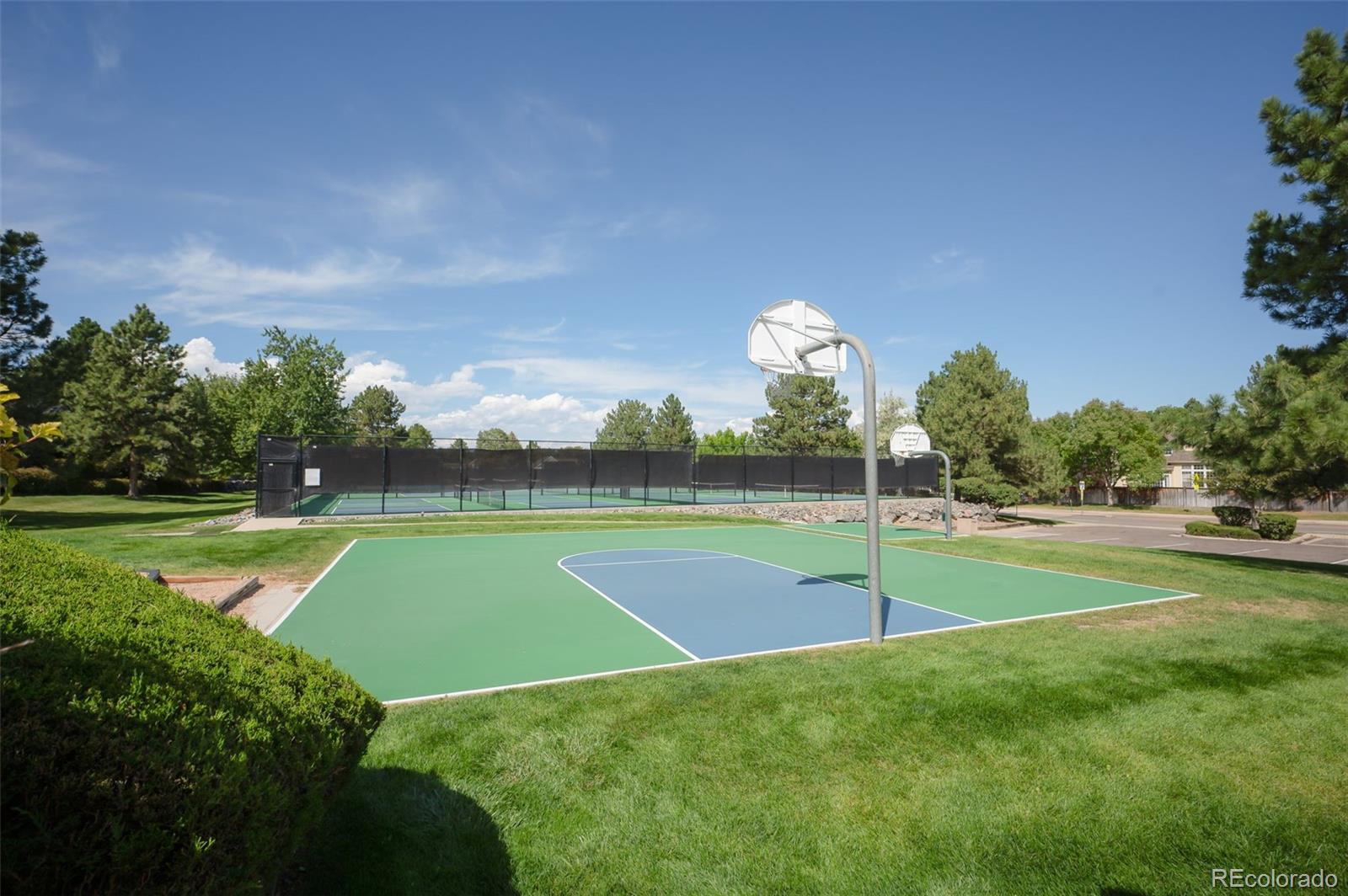 10058 Grove Court, Unit E Westminster, CO 80031 - Photo 42 of 48 a view of a golf course with a lake