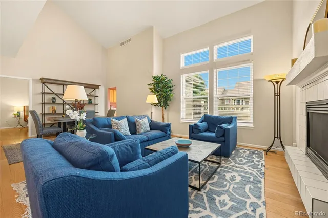 a living room with furniture fireplace and a flat screen tv