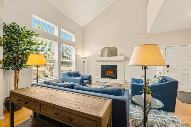 a living room with furniture and a lamp