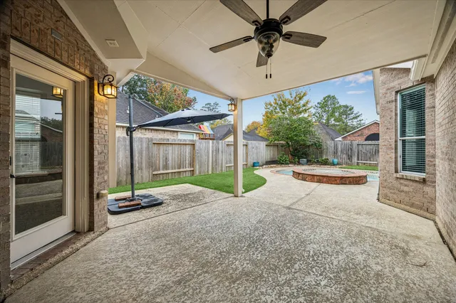 a view of a house with backyard and a garage