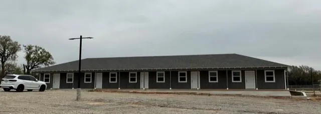 a picture of a bench in front of gate