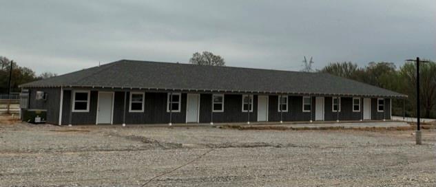 229 Pvt Road, Unit 200 Alvord, TX 76225 - Photo 22 of 25 a front view of a house with a garden