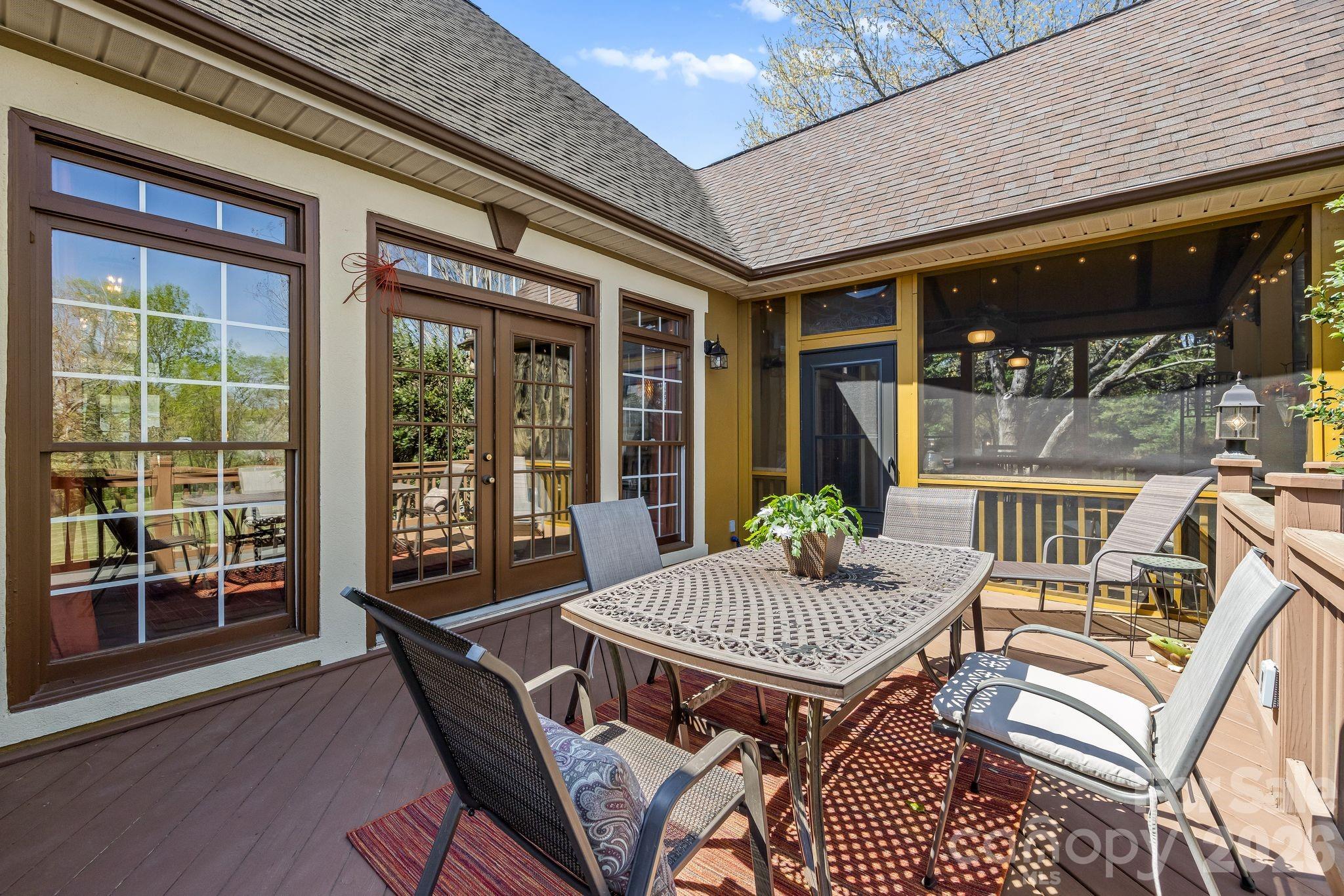 3530 Cardiff Lane Matthews, NC 28104 - Photo 17 of 39 a view of a patio with table and chairs and potted plants