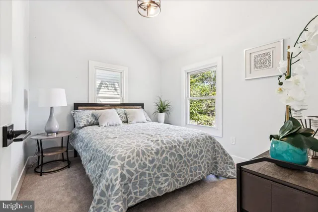 a bedroom with a bed and a couch