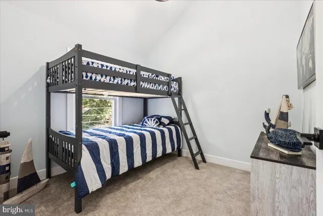 a front view of a bedroom with a bed