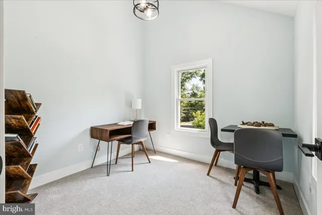 a work room with furniture and a window