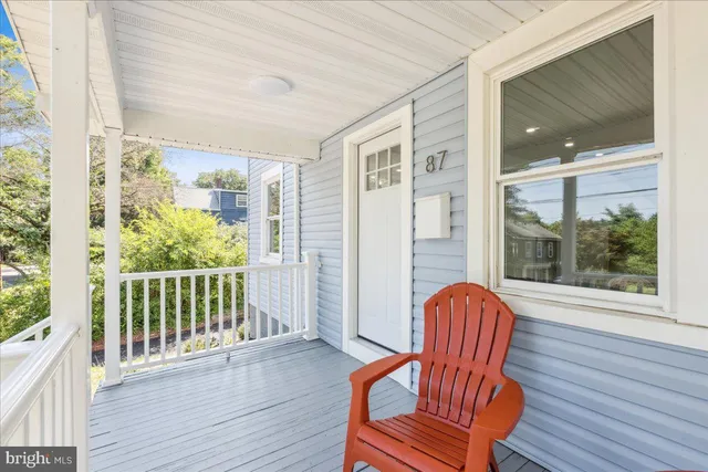 a view of a two chairs in the balcony