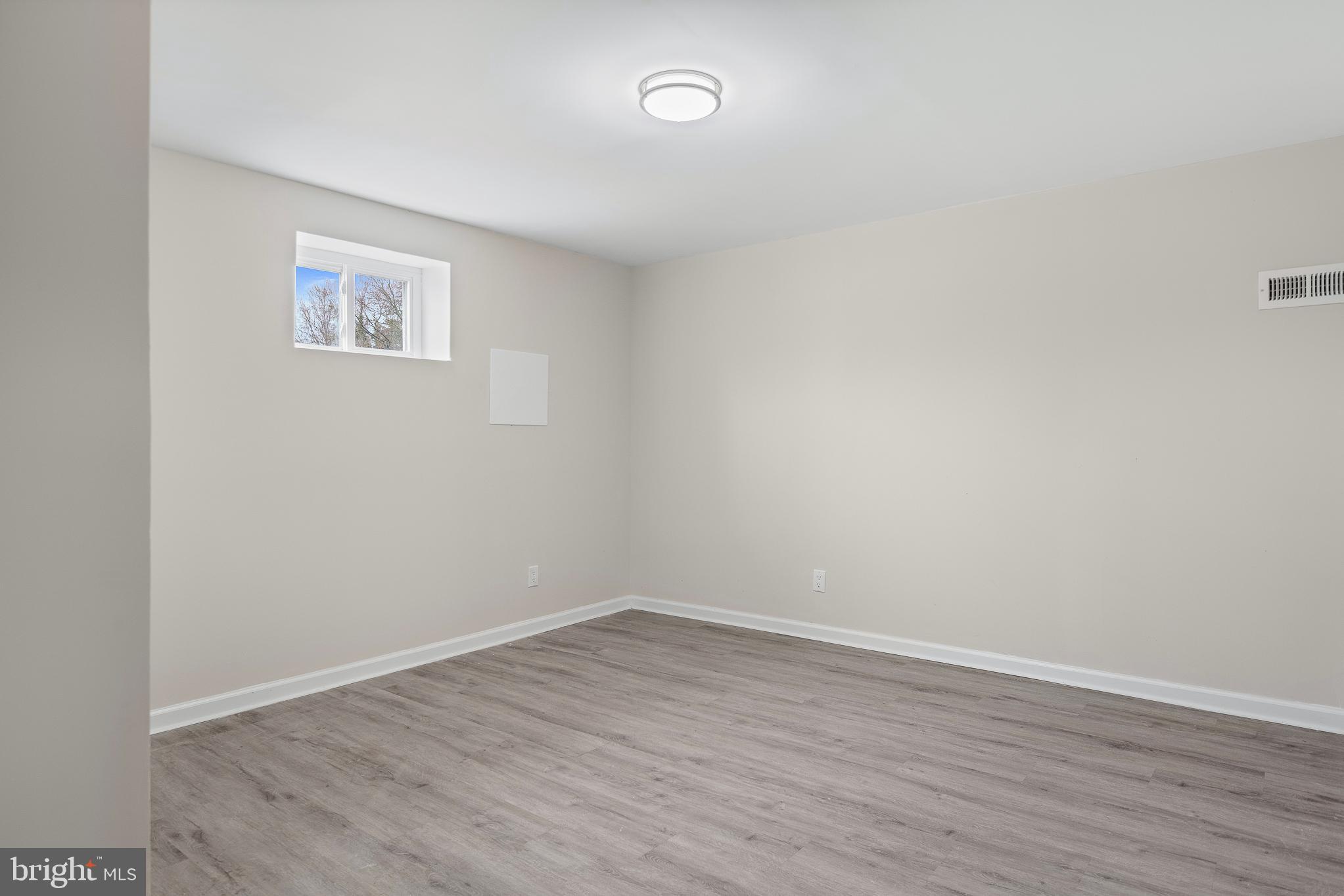 7804 D'Arcy Road District Heights, MD 20747 - Photo 15 of 61 a view of a small space with wooden floor and a window