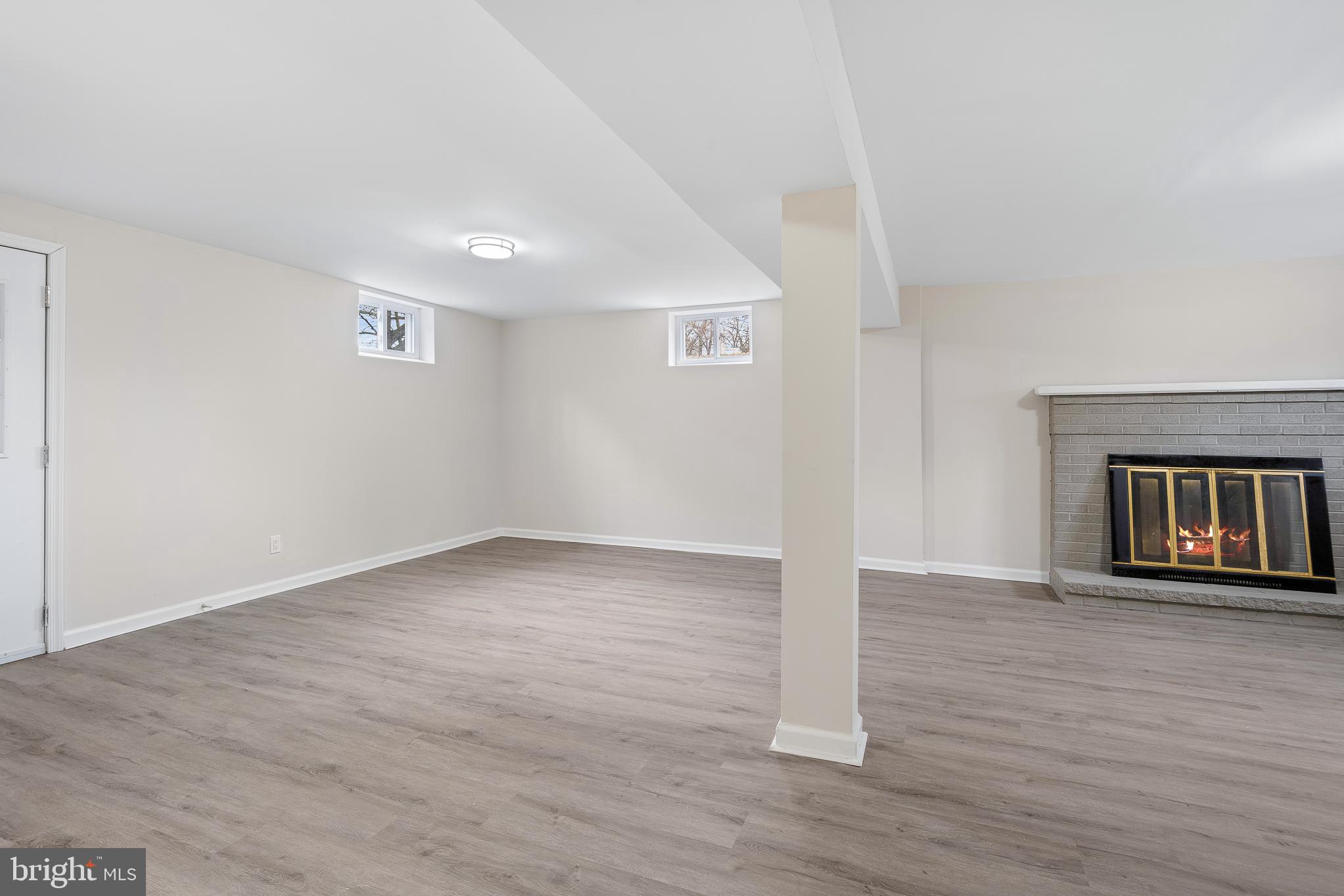 7804 D'Arcy Road District Heights, MD 20747 - Photo 20 of 61 a view of an empty room with wooden floor and a window