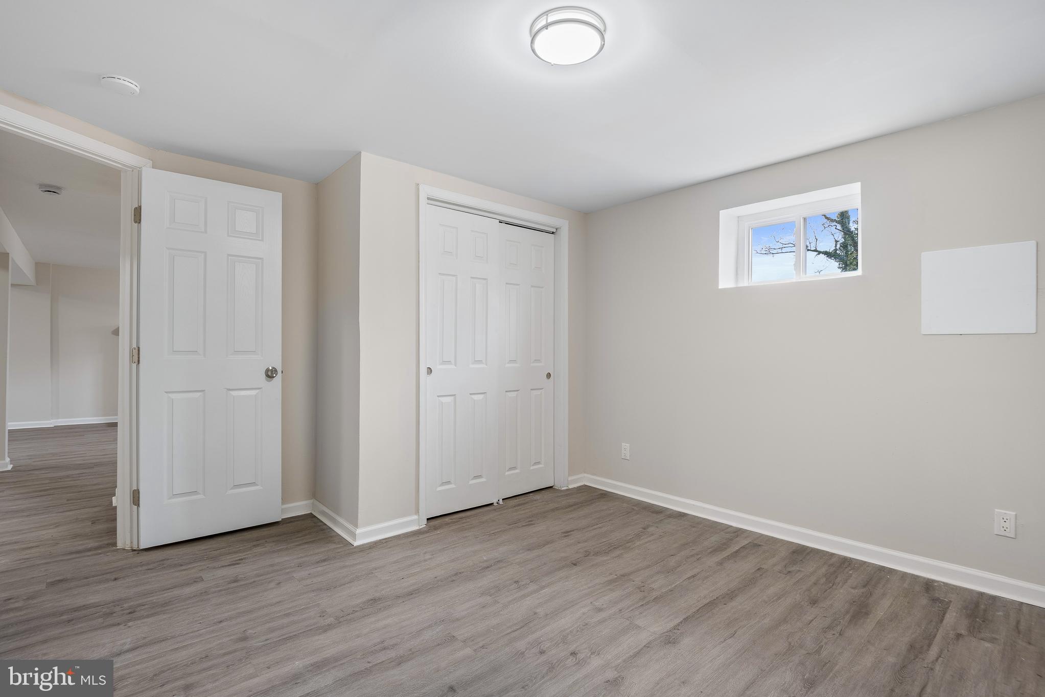 7804 D'Arcy Road District Heights, MD 20747 - Photo 21 of 61 a view of an empty room with wooden floor