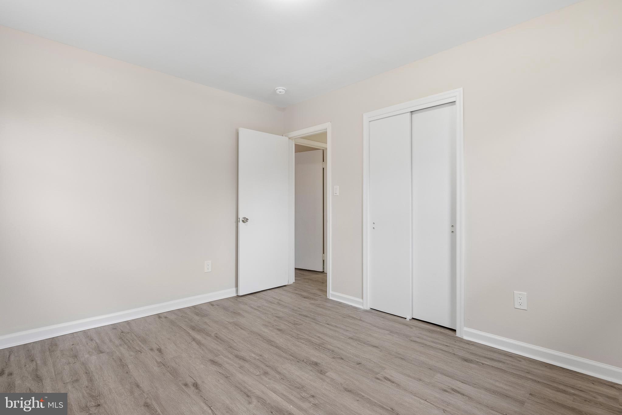 7804 D'Arcy Road District Heights, MD 20747 - Photo 24 of 61 a view of an empty room with wooden floor