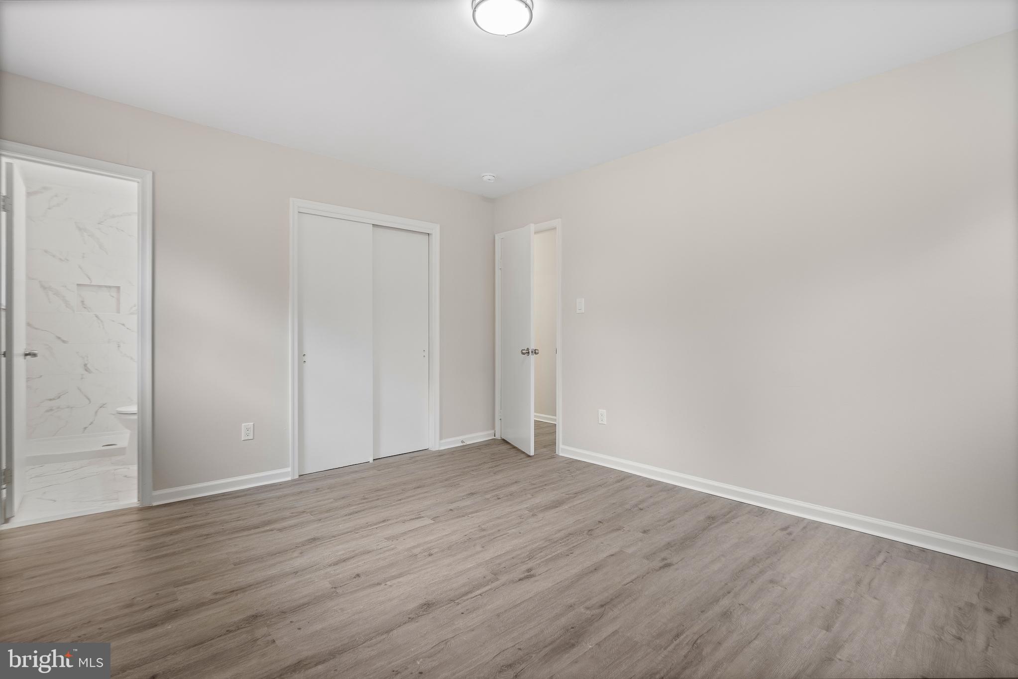 7804 D'Arcy Road District Heights, MD 20747 - Photo 28 of 61 a view of an empty room with wooden floor