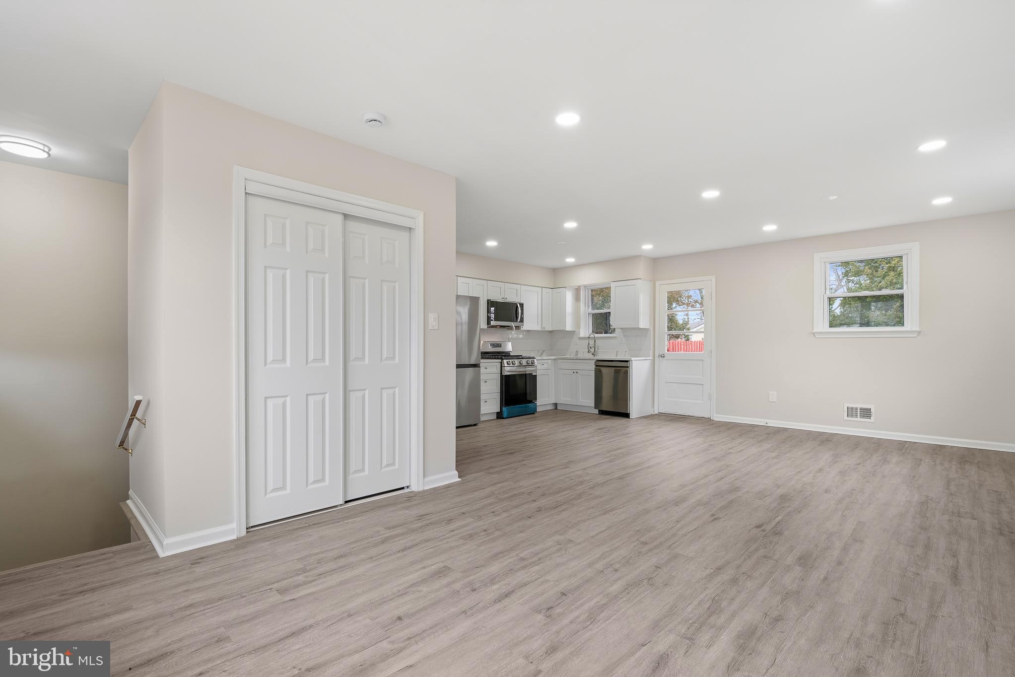 7804 D'Arcy Road District Heights, MD 20747 - Photo 3 of 61 an empty room with wooden floor and windows