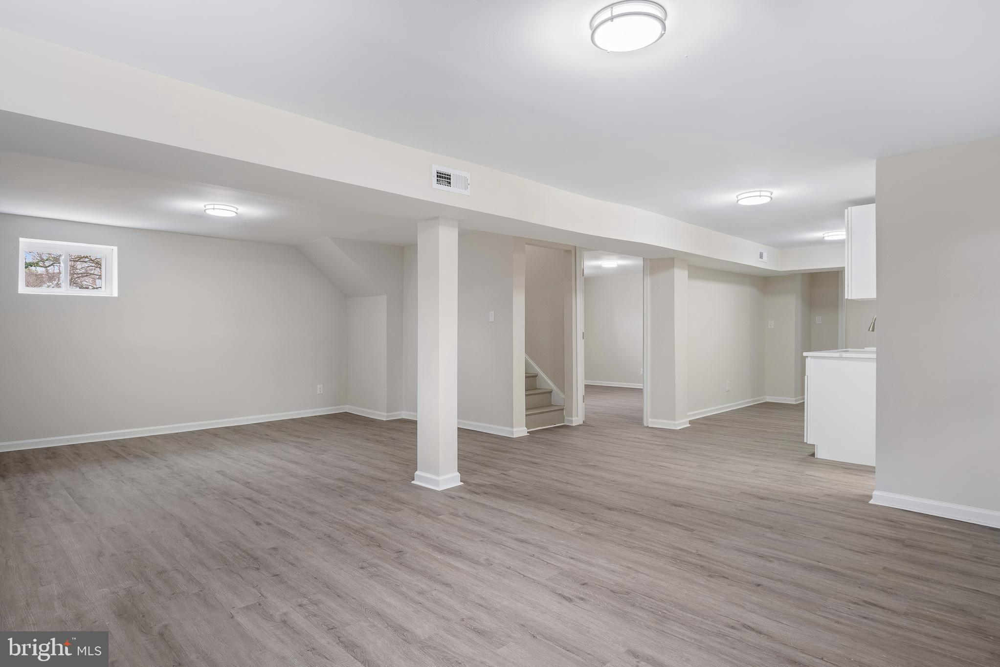 7804 D'Arcy Road District Heights, MD 20747 - Photo 38 of 61 a view of an empty room with wooden floor