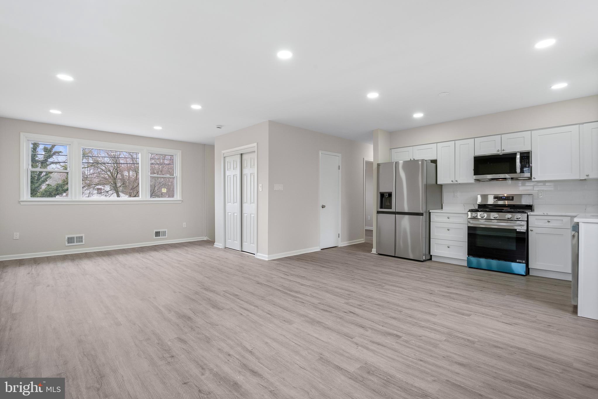 7804 D'Arcy Road District Heights, MD 20747 - Photo 4 of 61 a view of kitchen with microwave and refrigerator