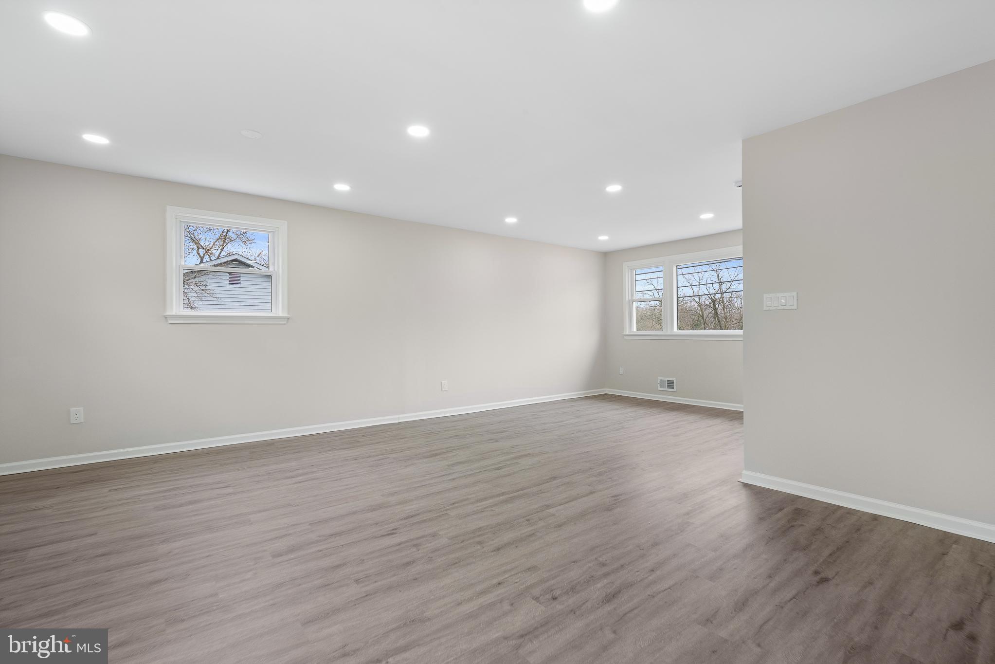 7804 D'Arcy Road District Heights, MD 20747 - Photo 42 of 61 a view of an empty room with wooden floor and a window