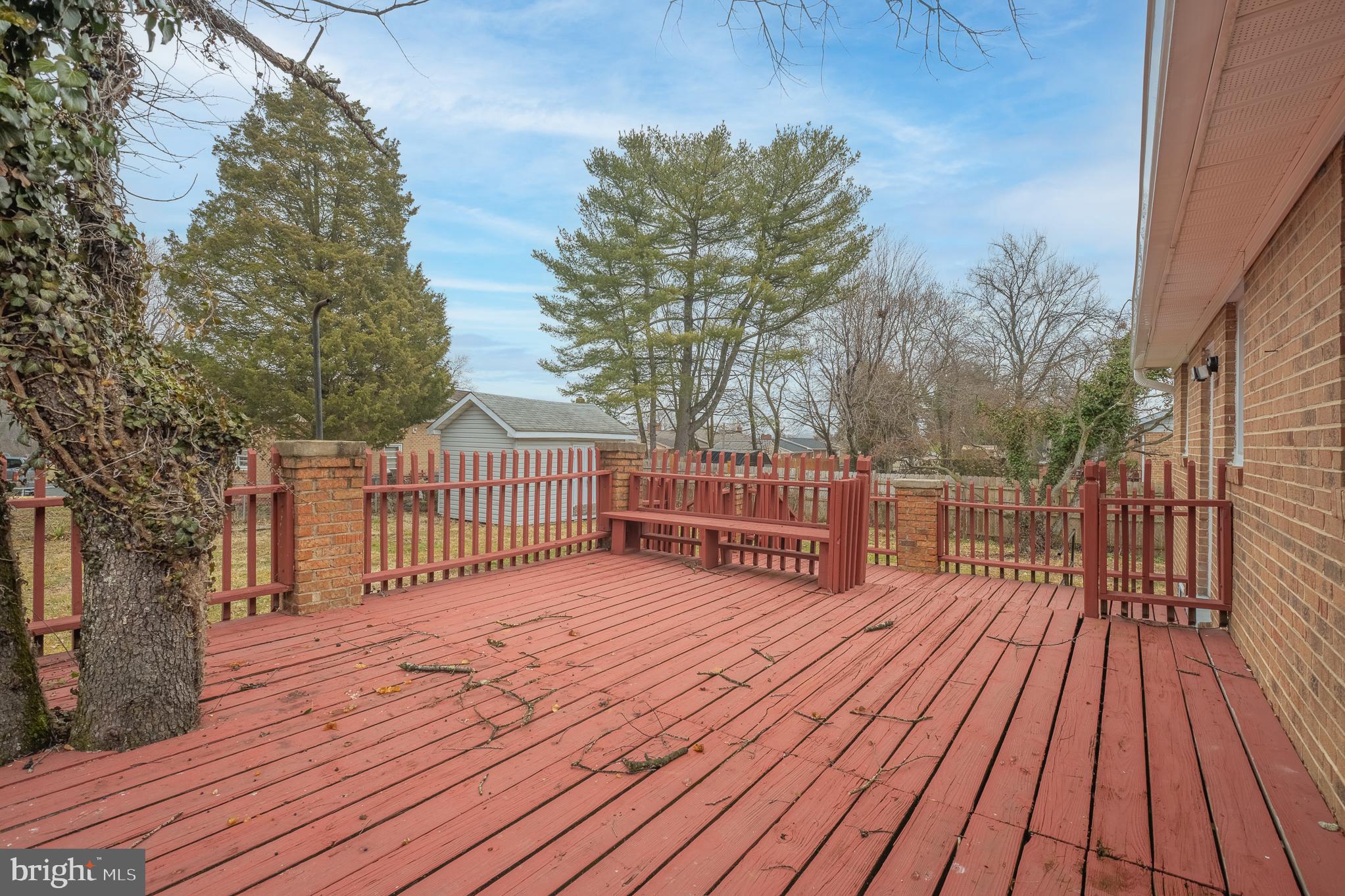 7804 D'Arcy Road District Heights, MD 20747 - Photo 52 of 61 a view of deck with wooden floor and trees