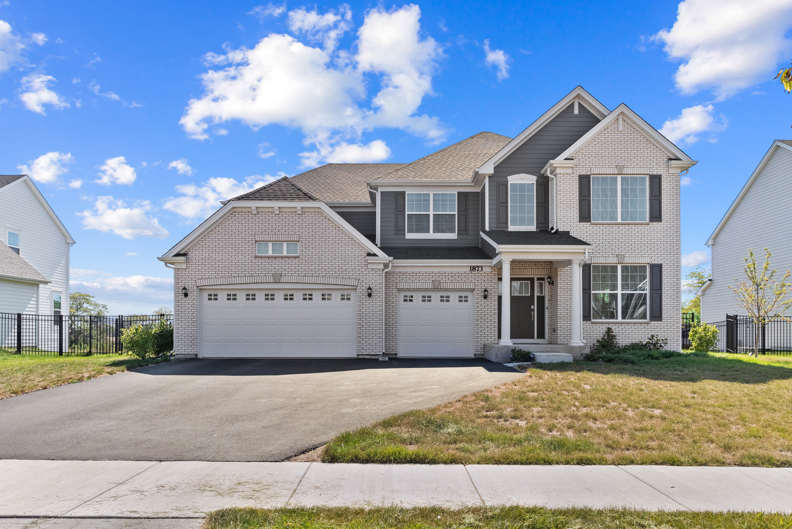 a front view of a house with a yard