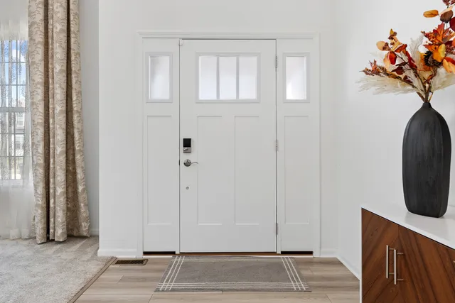 a view of entryway with wooden floor