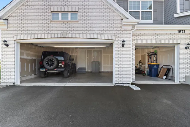 a view of a livingroom with a fireplace and a window