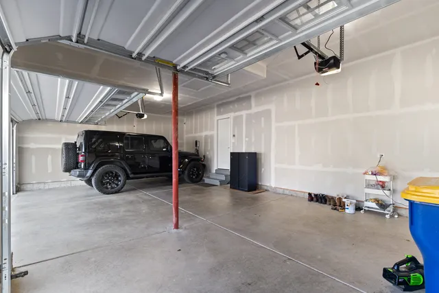 a view of parking garage with cars