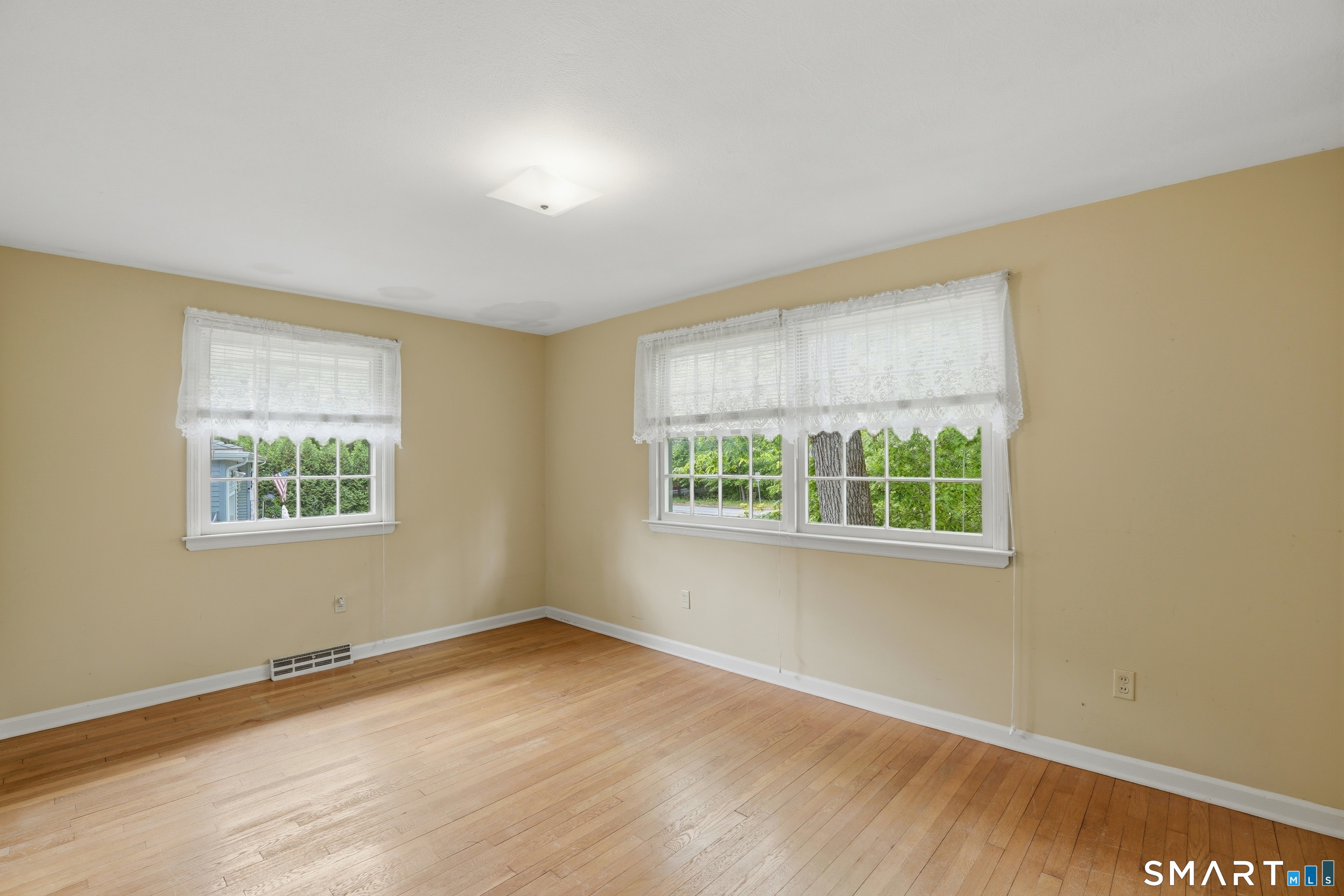 731 Still Hill Road Hamden, CT 06518 - Photo 15 of 40 a view of an empty room with wooden floor and a window