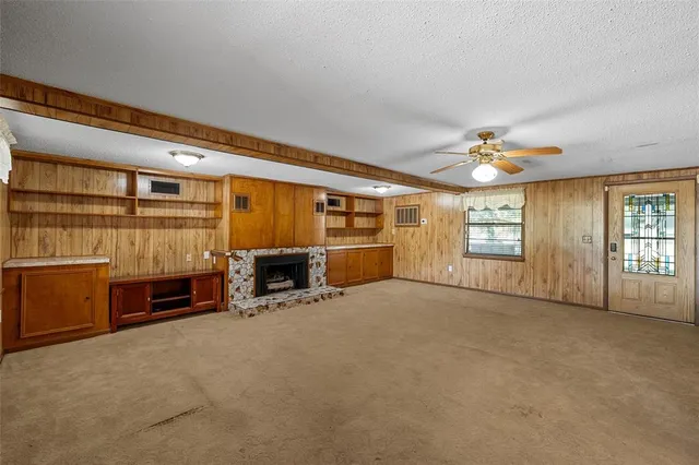 a view of a livingroom with furniture and windows