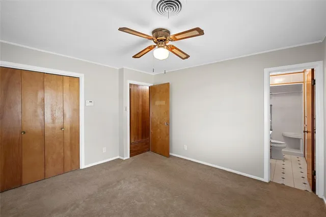 a view of a livingroom with a ceiling fan and a window