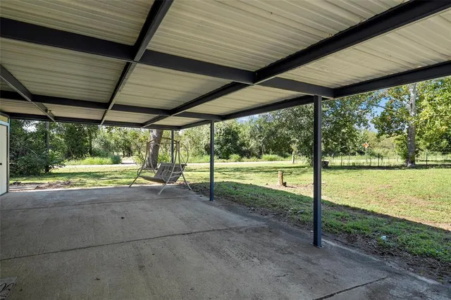 a view of a backyard with wooden floor and roof