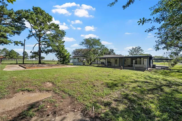 a view of a house with a big yard