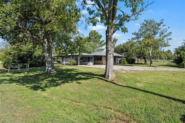 a view of backyard with green space