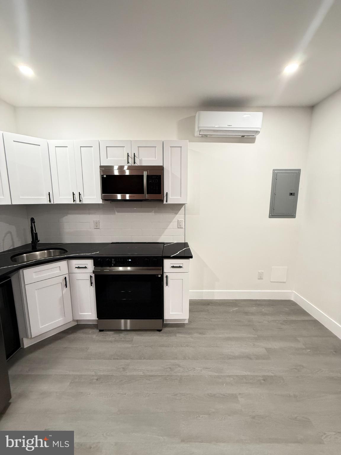 4539 North 18th Street Philadelphia, PA 19140 - Photo 14 of 25 a kitchen with a sink and a stove top oven
