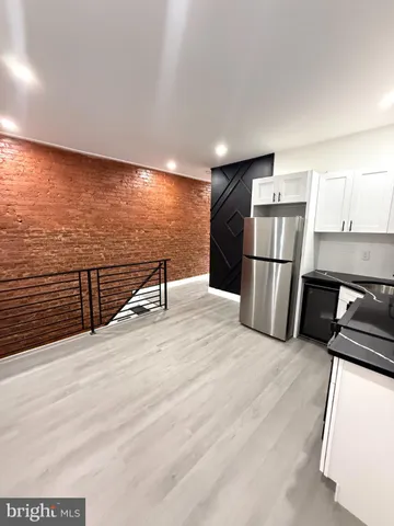 a bathroom with a toilet a sink and bathtub