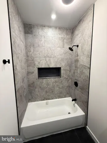 a white toilet sitting next to a bathroom sink