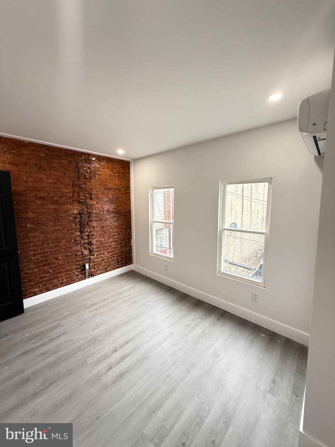 4539 North 18th Street Philadelphia, PA 19140 - Photo 25 of 25 wooden floor in an empty room with a window