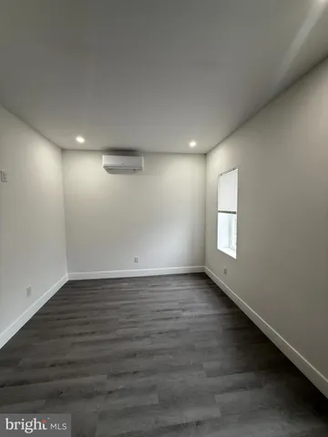 a kitchen with a refrigerator and a sink