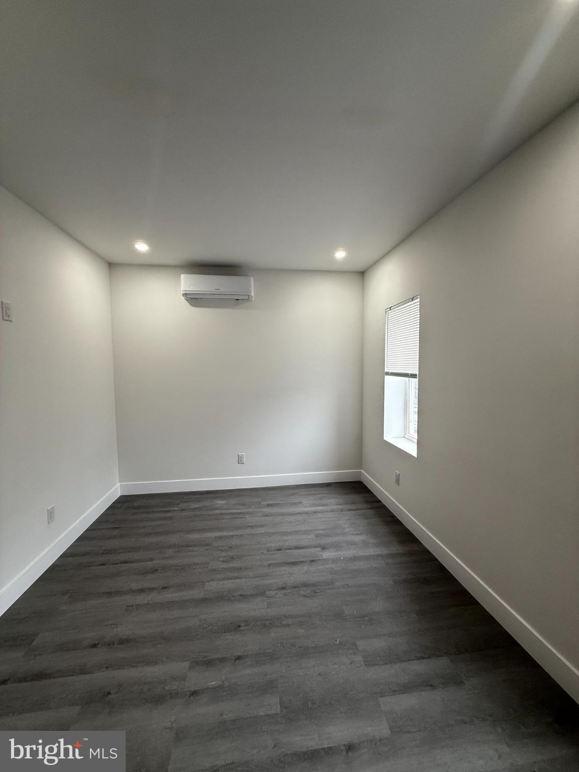 4539 North 18th Street Philadelphia, PA 19140 - Photo 9 of 25 an empty room with wooden floor and windows