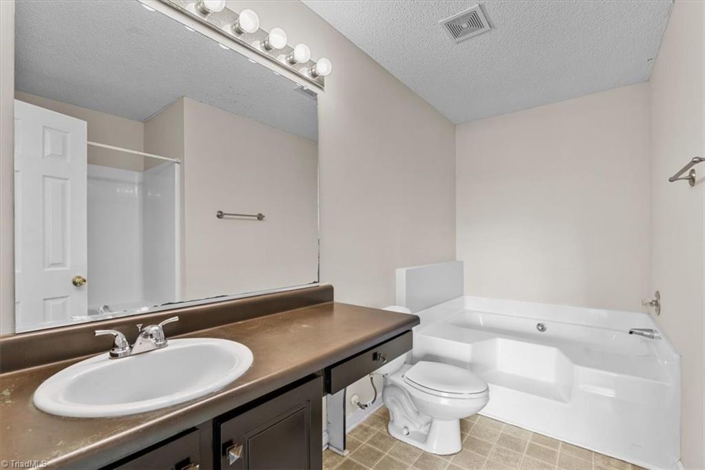 311 Ridgeland Drive High Point, NC 27262 - Photo 20 of 42 Primary bathroom with separate shower
