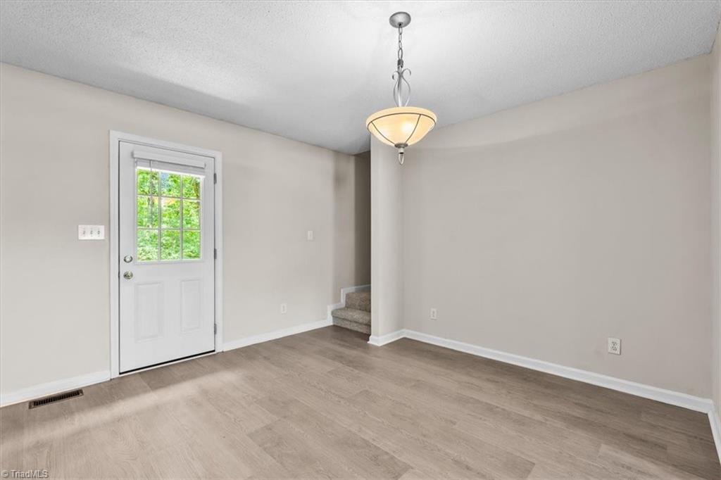 311 Ridgeland Drive High Point, NC 27262 - Photo 10 of 42 Stairs of dining room to upstairs flex space