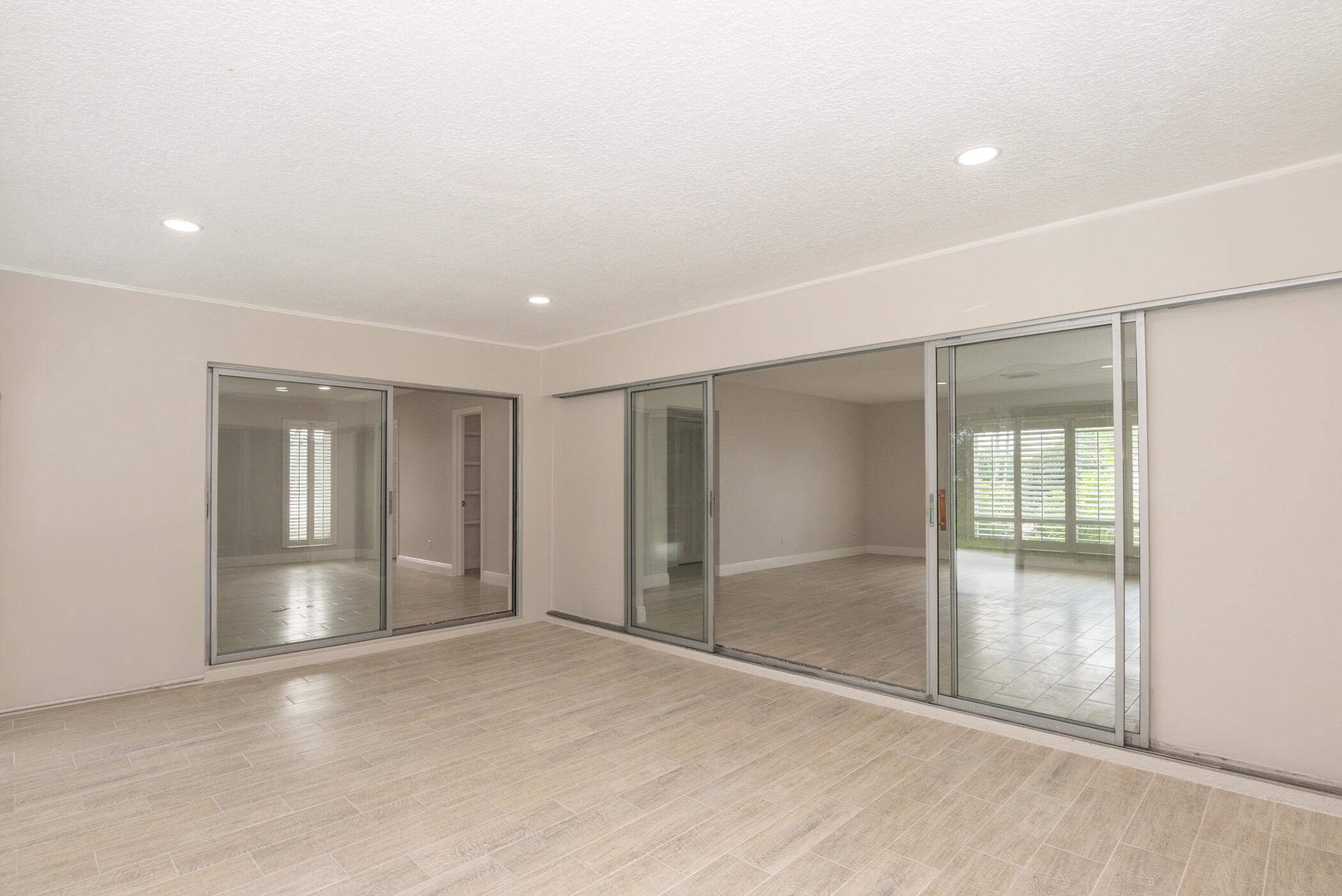 3441 Southeast Court Drive Stuart, FL 34997 - Photo 20 of 46 an empty room with an empty space and glass door