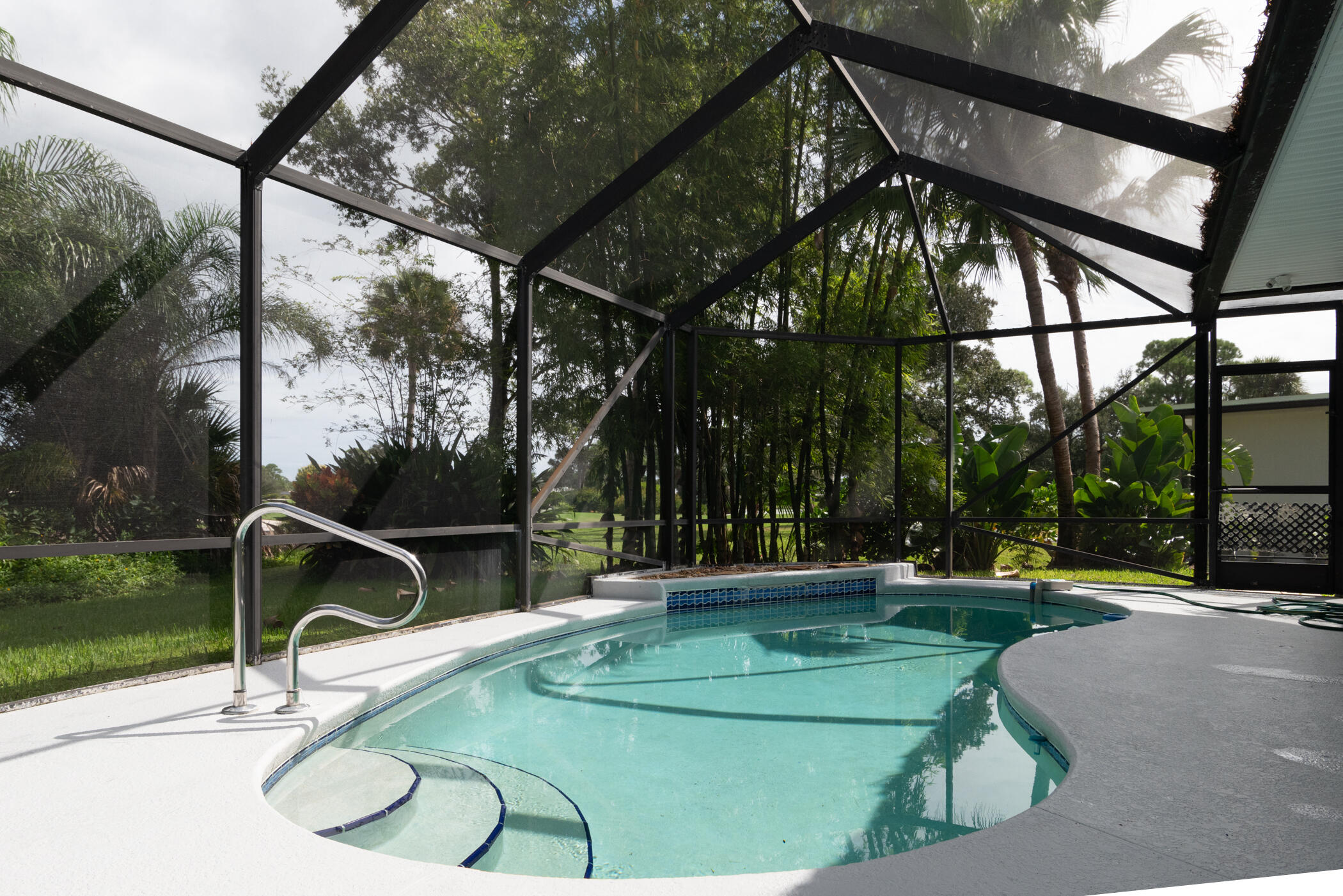 3441 Southeast Court Drive Stuart, FL 34997 - Photo 37 of 46 a view of a swimming pool with a patio and a yard