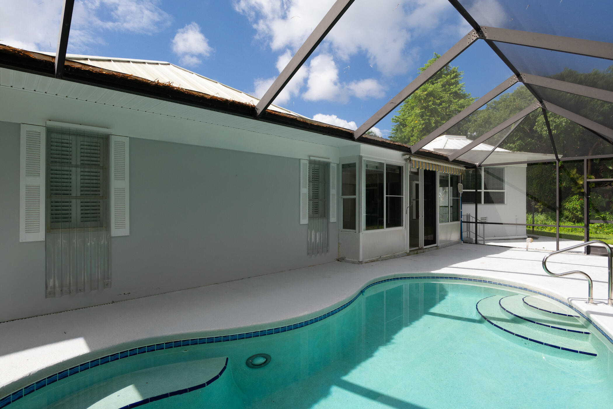 3441 Southeast Court Drive Stuart, FL 34997 - Photo 39 of 46 a view of a house with backyard patio and porch