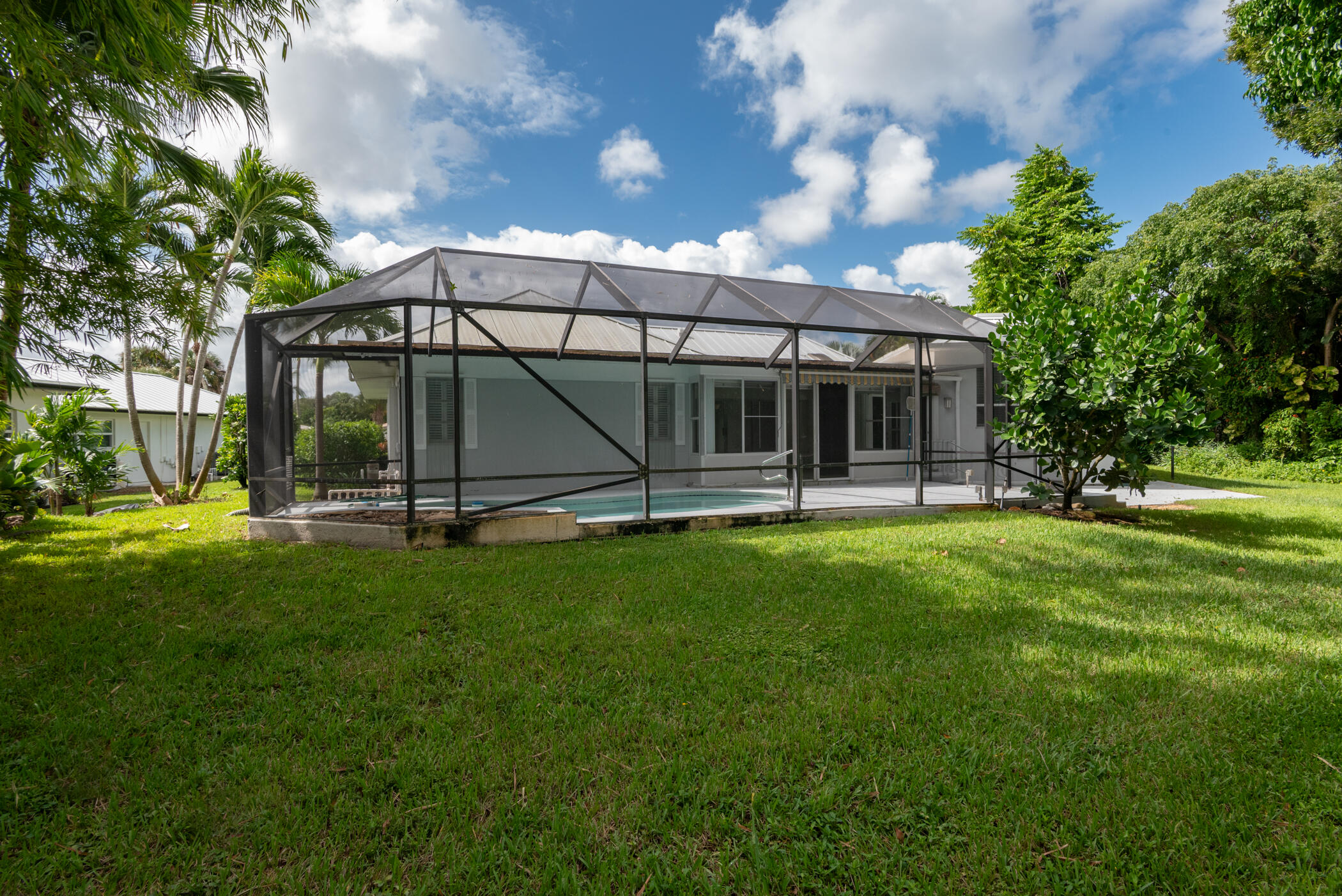 3441 Southeast Court Drive Stuart, FL 34997 - Photo 40 of 46 a view of a house with a yard