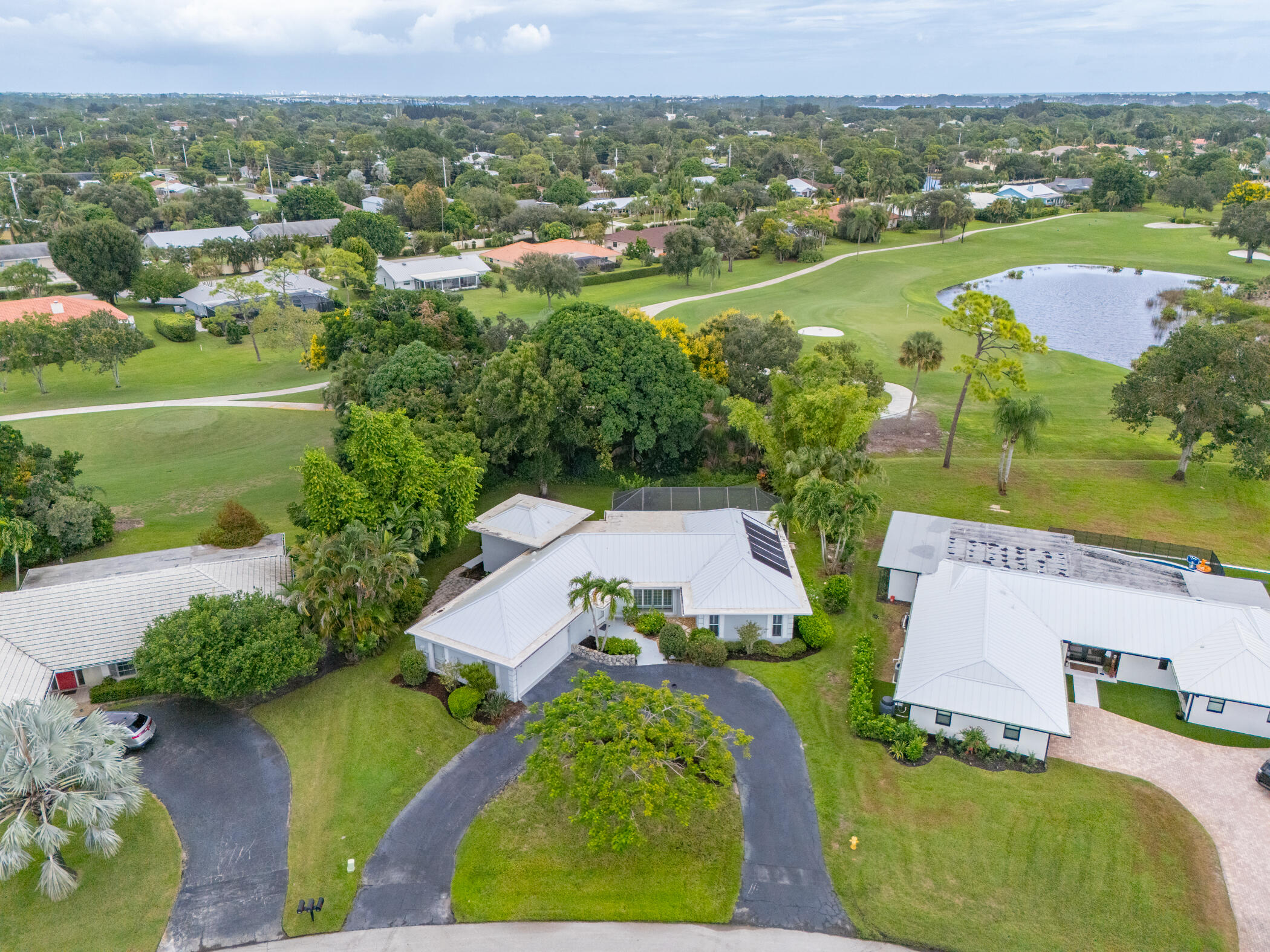 3441 Southeast Court Drive Stuart, FL 34997 - Photo 44 of 46 an aerial view of a house with a garden