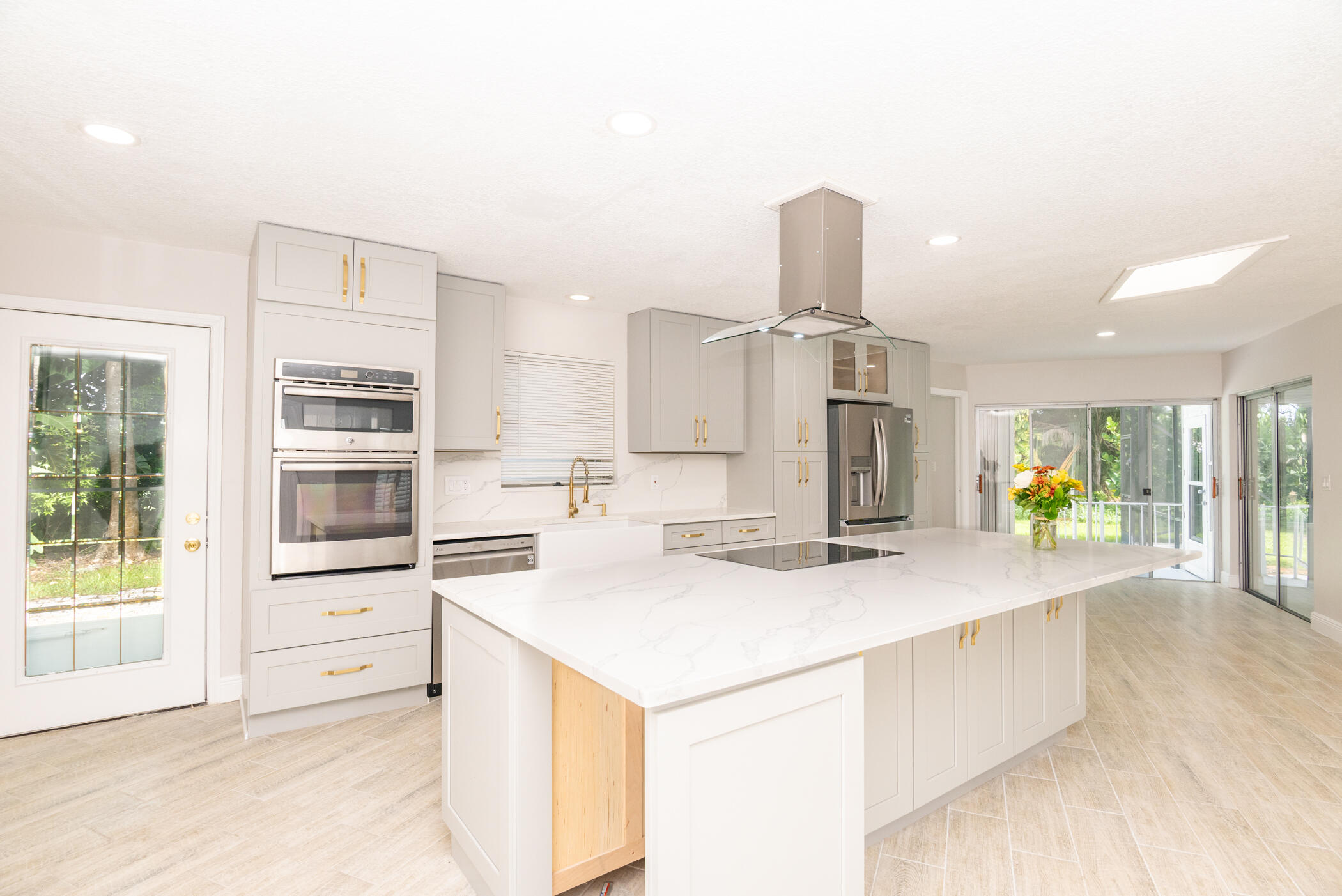 3441 Southeast Court Drive Stuart, FL 34997 - Photo 7 of 46 a kitchen with a stove a refrigerator and a sink