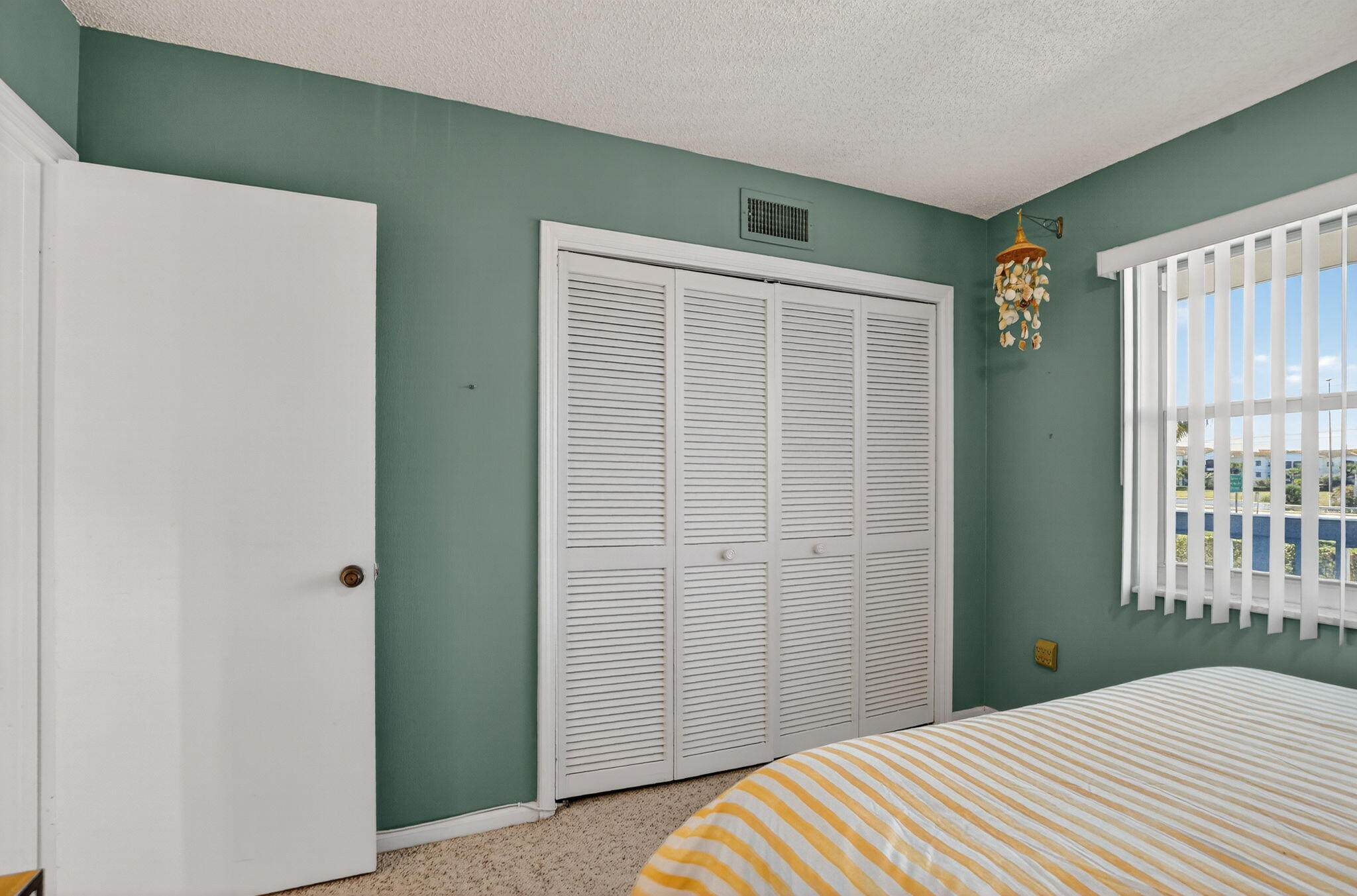 9880 Marina Boulevard, Unit 1522 Boca Raton, FL 33428 - Photo 14 of 52 a bedroom with a bed and a window