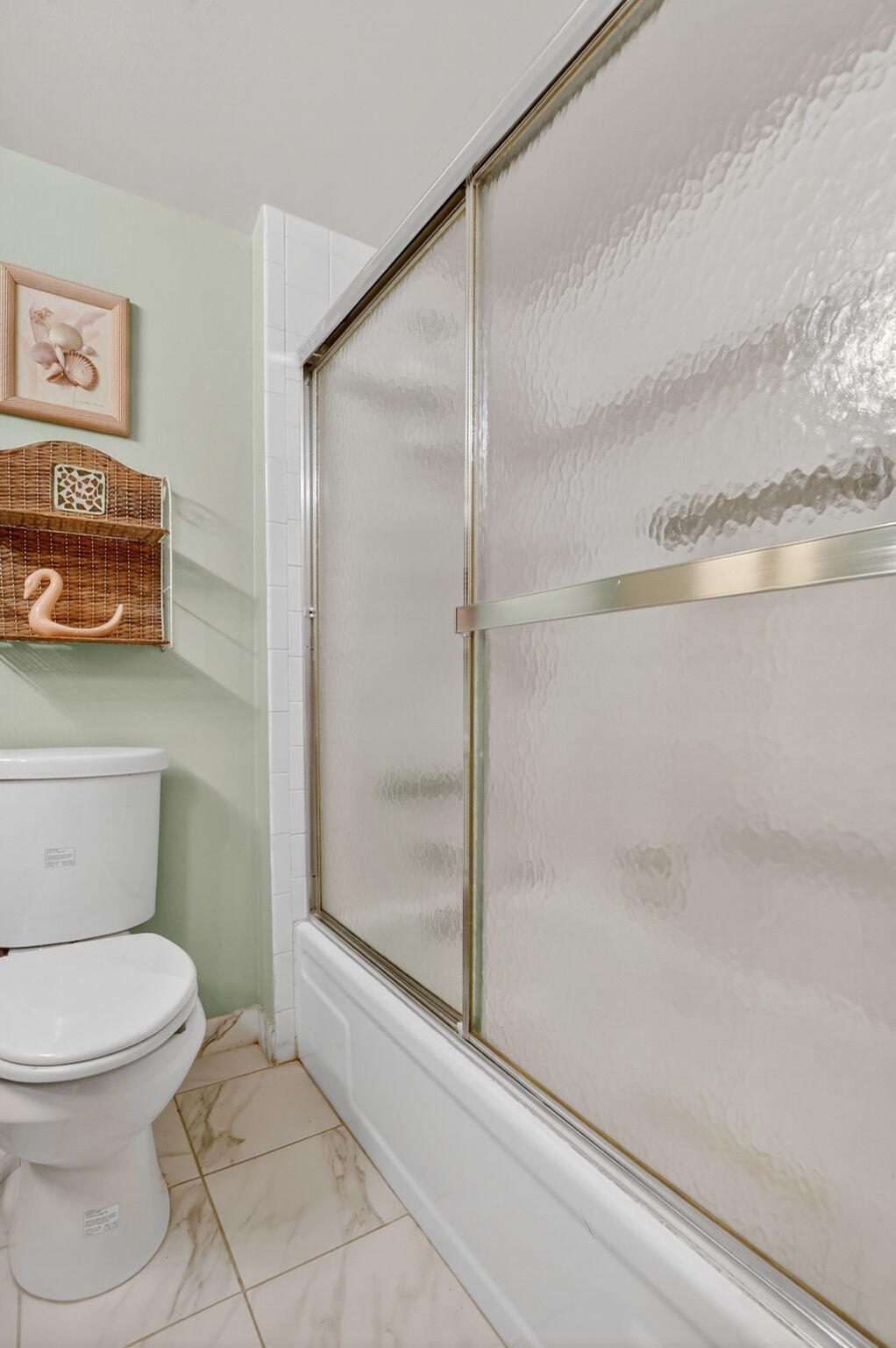 9880 Marina Boulevard, Unit 1522 Boca Raton, FL 33428 - Photo 21 of 52 a bathroom with a toilet and a shower