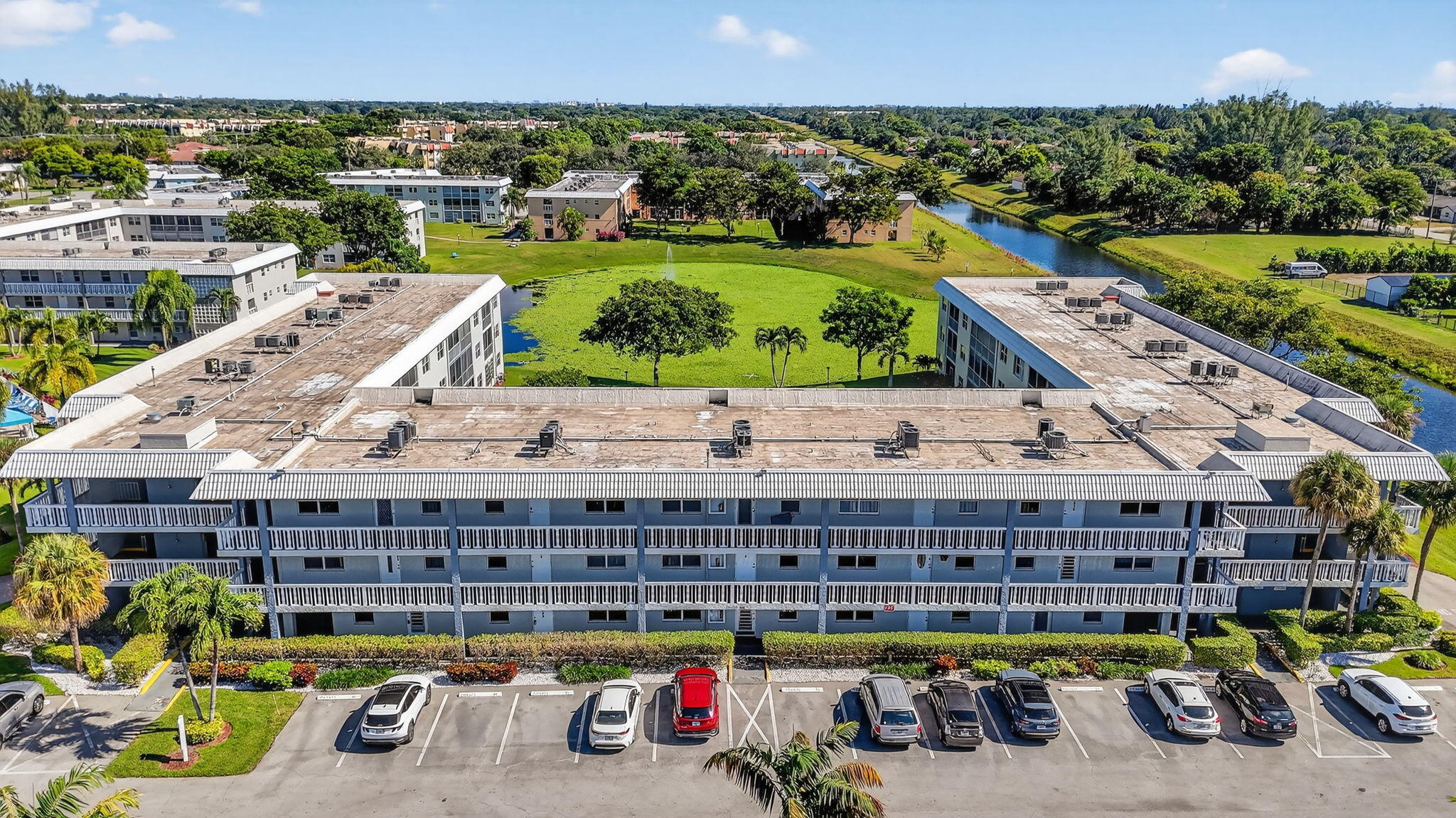 9880 Marina Boulevard, Unit 1522 Boca Raton, FL 33428 - Photo 32 of 52 a view of a swimming pool with furniture