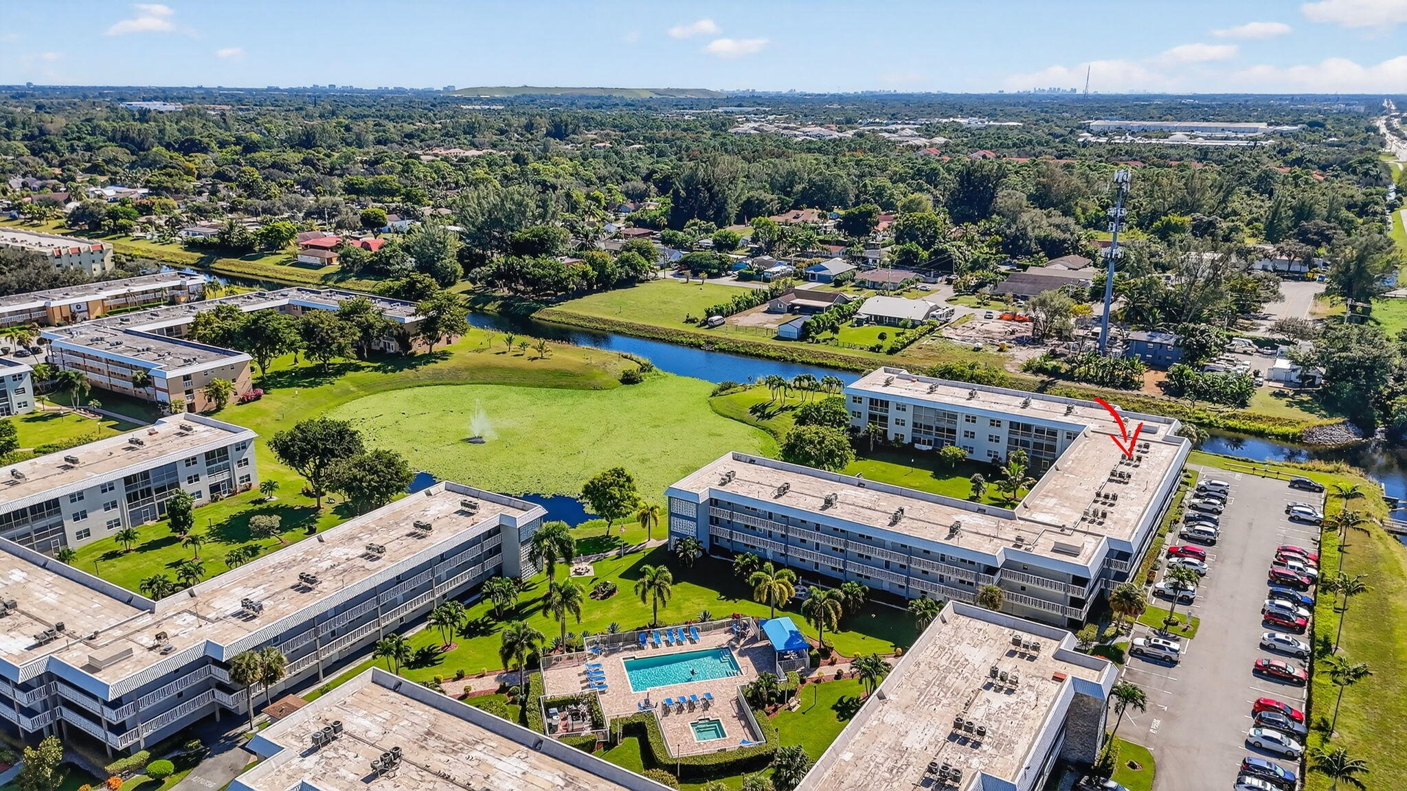 9880 Marina Boulevard, Unit 1522 Boca Raton, FL 33428 - Photo 38 of 52 an aerial view of a houses with a swimming pool